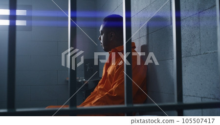 Guilty prisoner sits and thinks about freedom Guilty prisoner sits and thinks about freedom 105507417