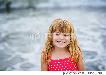 Portrait of Happy Child, Little Preschool Girl in Swimmsuit Running And Jumping In The Waves During Summer Vacation On Exotic Tropical Beach. Family Journey On Ocean Coast. Portrait of Happy Child, Little Preschool Girl in Swimmsuit Running And Jumping In The Waves During Summer Vacation On Exotic Tropical Beach. Family Journey On Ocean Coast. 105507908