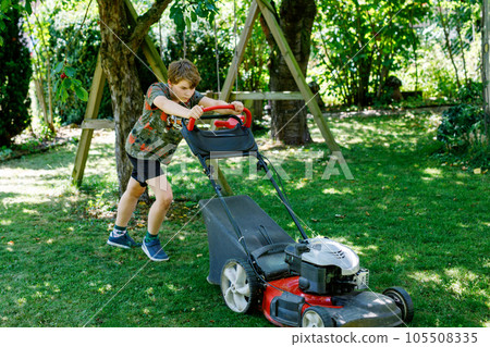 Happy preteen kid boy with lawn mower. Portrait of smiling teenager child working in garden, trimming grass. Garden works in summer. Kid helping Happy preteen kid boy with lawn mower. Portrait of smiling teenager child working in garden, trimming grass. Garden works in summer. Kid helping 105508335