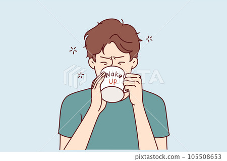 Man drinks coffee from mug with inscription wake up, wanting to cheer up and gain strength 105508653