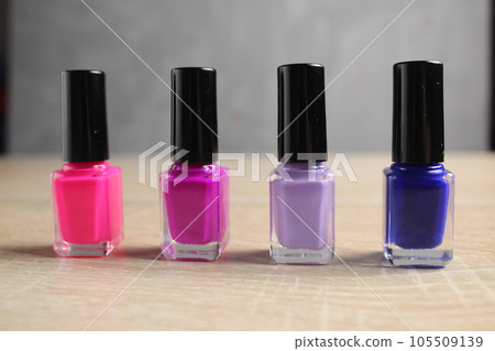 palette of colors of nail polishes business manicure for nails. Nail service. How to choose the color of nail polish pink lilac blue yellow orange palette of colors of nail polishes business manicure for nails. Nail service. How to choose the color of nail polish pink lilac blue yellow orange 105509139