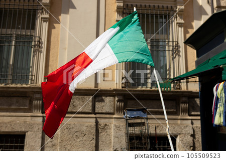 Italian Flag over window's house in the Italian street. Travel and tourism in Europe. Copy space Italian Flag over window's house in the Italian street. Travel and tourism in Europe. Copy space 105509523