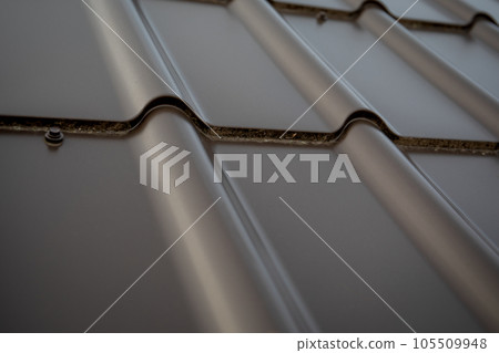 Gray tile roof background. Close Up roofing texture pattern. Materials to build a house for sun and Gray tile roof background. Close Up roofing texture pattern. Materials to build a house for sun and 105509948