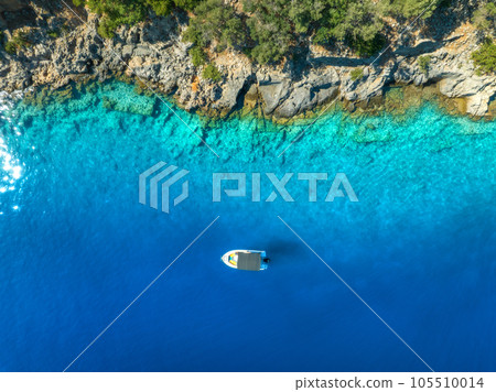 Aerial view of alone small motorboat on the sea in summer 105510014