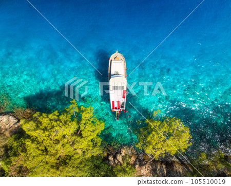 Aerial view of yachts and boats on the sea at sunset in summer 105510019