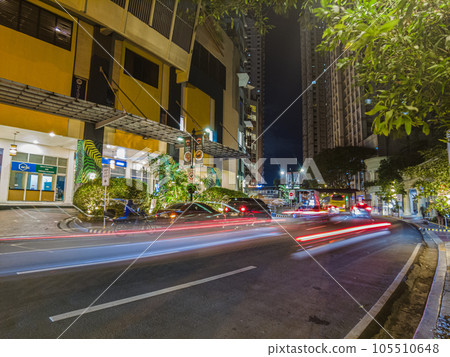 Night street scene from Eastwood neighborhood in Manila 105510648