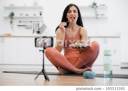 Female recording video on smartphone about healthy diet Female recording video on smartphone about healthy diet 105511391