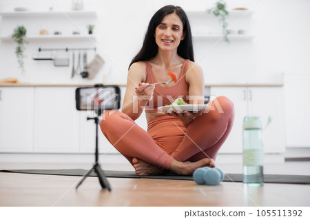 Female recording video on smartphone about healthy diet Female recording video on smartphone about healthy diet 105511392