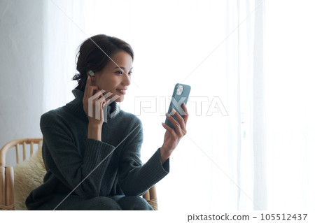 A woman listening to music 105512437