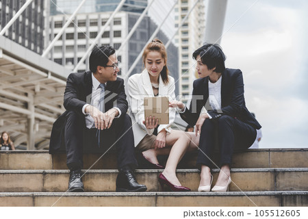 Business Woman Partner talk, meeting team Partnership in modern city together. Diversity Asian Business Partner online meeting trust teamwork. Asian Two Business people teams meeting outdoor in city. Business Woman Partner talk, meeting team Partnership in modern city together. Diversity Asian Business Partner online meeting trust teamwork. Asian Two Business people teams meeting outdoor in city. 105512605