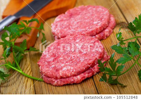Image of raw burger cutlet and greens before cooking, Image of raw burger cutlet and greens before cooking, 105512848