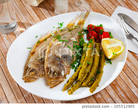 Oven baked rooster fish with marinated asparagus Oven baked rooster fish with marinated asparagus 105512905