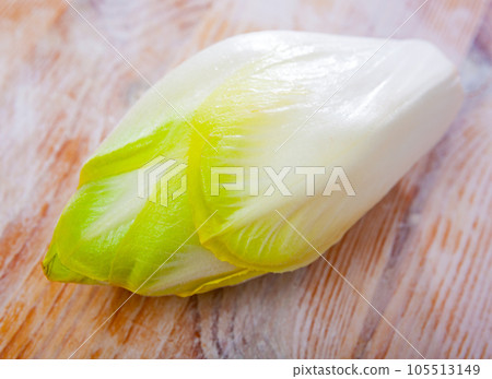 Raw organic endives on wooden table Raw organic endives on wooden table 105513149