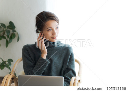 Woman using a laptop Woman using a laptop 105513166