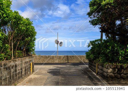 T-junctions and curved mirrors in a country town along the coast of a tropical island T-junctions and curved mirrors in a country town along the coast of a tropical island 105513941