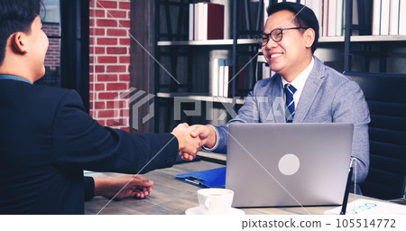 Team Business Partners shaking hands together to Greeting Start up small business in meeting room. Shakehand teamwork partners at modern office handshake together. Business mergers and acquisitions 105514772