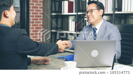Team Business Partners shaking hands together to Greeting Start up small business in meeting room. Shakehand teamwork partners at modern office handshake together. Business mergers and acquisitions 105514773