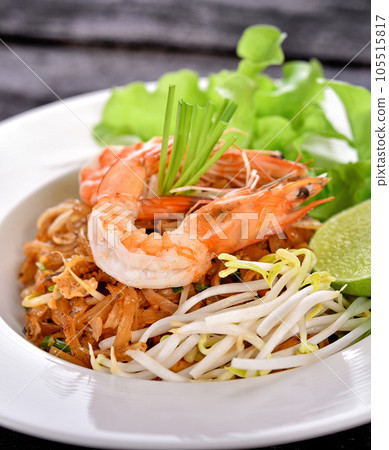 Thai style noodles. Pad Thai, Asian Cuisine on the table Thai style noodles. Pad Thai, Asian Cuisine on the table 105515817