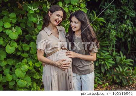 A heartwarming moment captured in the park as a pregnant woman after 40 shares a special bond with her teenage daughter, embracing the beauty of mother-daughter connection A heartwarming moment captured in the park as a pregnant woman after 40 shares a special bond with her teenage daughter, embracing the beauty of mother-daughter connection 105516045