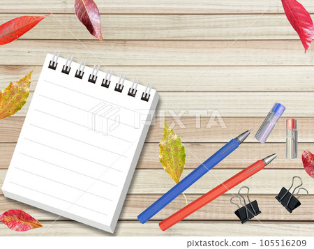 A notepad, pen and clip on a wooden table A notepad, pen and clip on a wooden table 105516209
