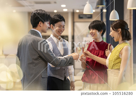Reception party image Young men and women toasting Reception party image Young men and women toasting 105516280