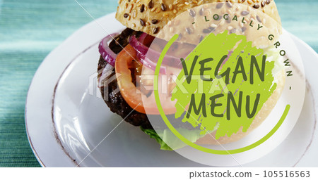Composite of vegan menu text over vegan burger on white plate Composite of vegan menu text over vegan burger on white plate 105516563