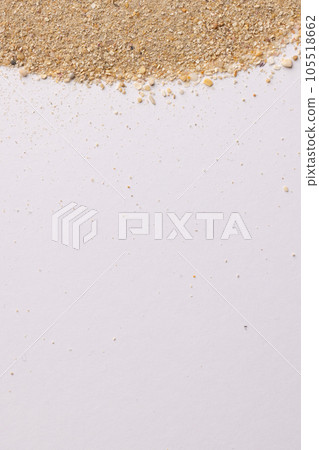 Close up of sand grains and copy space on white background Close up of sand grains and copy space on white background 105518662