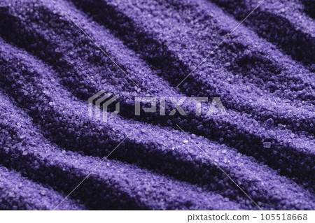 Close up of pattern of purple sand and copy space background Close up of pattern of purple sand and copy space background 105518668