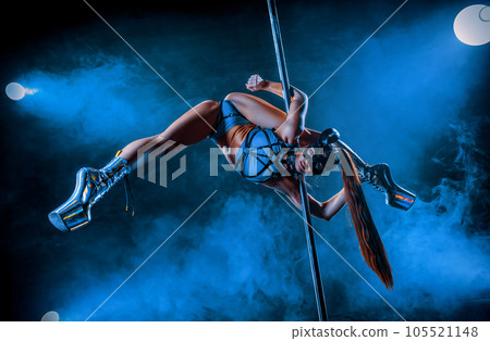 Young woman pole dancing 105521148