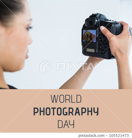 World photography day text on peach over asian woman looking at image on camera back 105521473