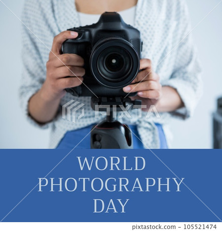 World photography day text on blue over midsection of biracial woman using camera on tripod 105521474