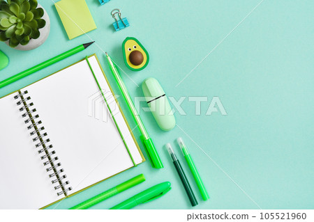 Banner with empty notebook page, green pen, pencil and marker Banner with empty notebook page, green pen, pencil and marker 105521960