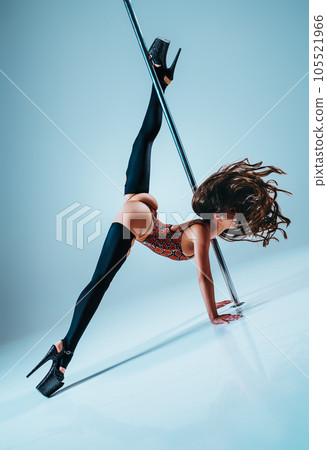 Woman pole dancing 105521966