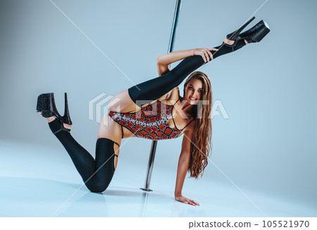 Woman pole dancing 105521970
