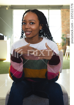 Happy african american casual businesswoman making video call in office 105522776