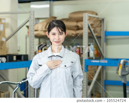 Young female staff standing in warehouse of distribution center 105524724