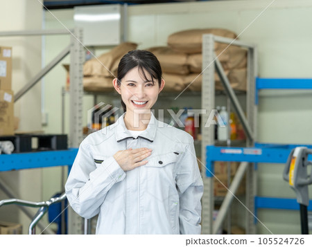 Young female staff standing in warehouse of distribution center 105524726