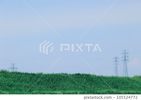 Steel tower towering over vast land 105524772
