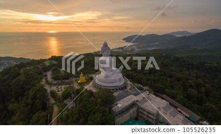 aerial view colorful yellow cloud in golden sky in sunset at Phuket big Buddha. creative travel concept. stunning yellow sky background. Phuket big Buddha is the popular landmark in Phuket. 105526235