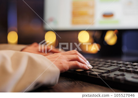 Businesswoman typing financial strategy on computer, analyzing marketing graphs report. Executive manager working late at night at company investment project in startup office. Corporate concept 105527046