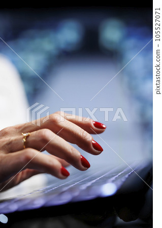 Octogenarian manager using laptop, setting up high bandwidth dedicated multiplayer gaming servers in high tech workplace to accommodate more traffic from worldwide locations, close up 105527071