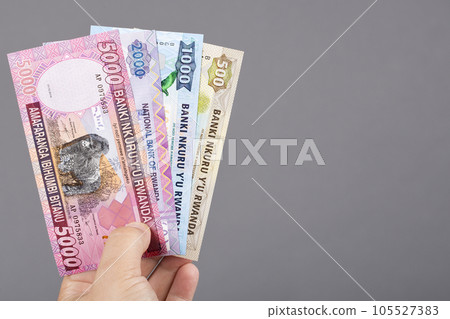 Rwandan money in the hand on a gray background 105527383