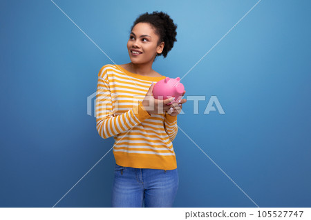 smile afro brunette 20s latin young woman holding piggy bank money smile afro brunette 20s latin young woman holding piggy bank money 105527747