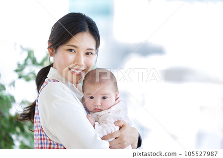 Nursery teacher baby hug Nursery teacher baby hug 105527987