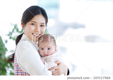 Nursery teacher baby hug Nursery teacher baby hug 105527988