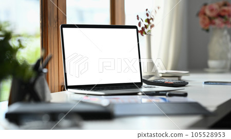 Laptop with blank display, coffee cup and stationery on white office desk Laptop with blank display, coffee cup and stationery on white office desk 105528953