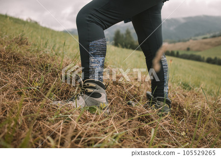 Hiking boot. Close up of a mountain hikers feet. High quality photo Hiking boot. Close up of a mountain hikers feet. High quality photo 105529265