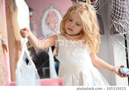 Cute little girl in the dressing room 105529315