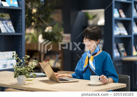 A business woman in her 30s working on a laptop A business woman in her 30s working on a laptop 105530165