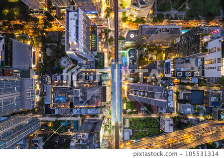 Aerial view of Ploenchit road by night in Bangkok Downtown, financial district and business center Aerial view of Ploenchit road by night in Bangkok Downtown, financial district and business center 105531314
